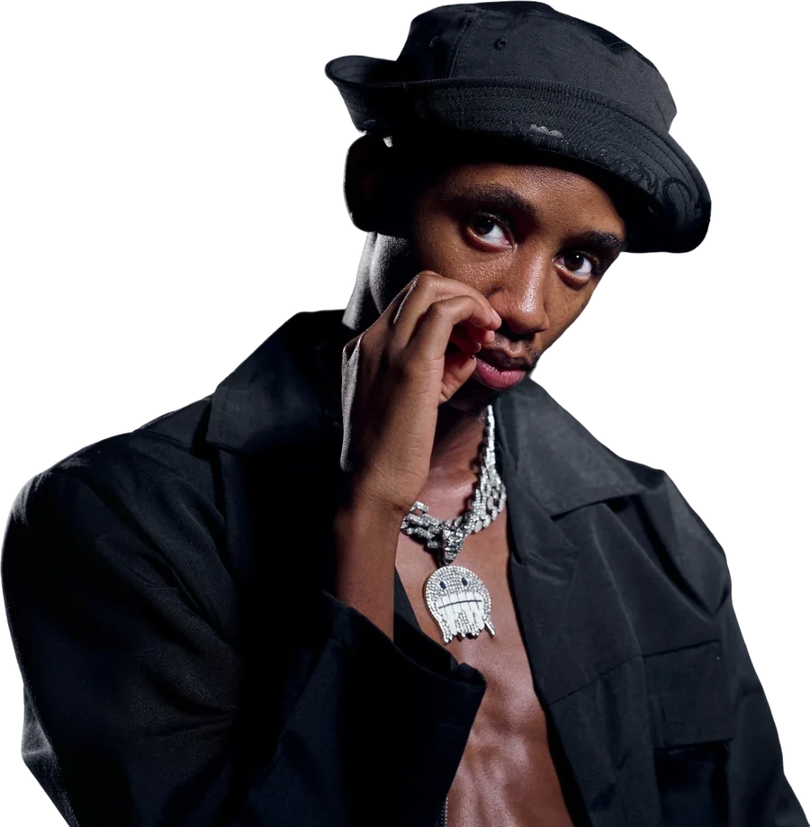 Scotts Maphuma in a black bucket hat and open black jacket, hand at his chin